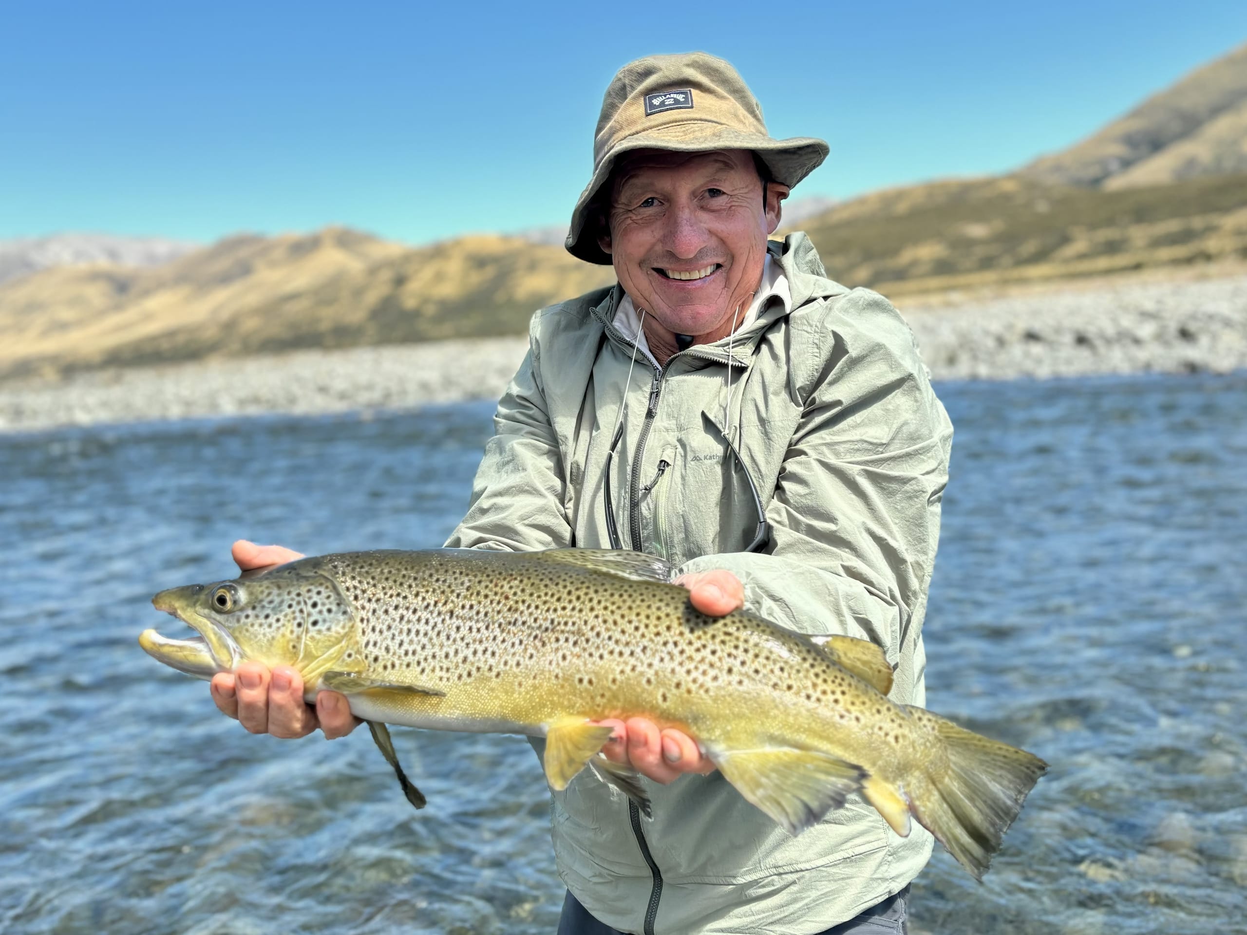 Wild trout landed on a South Island backcountry river
