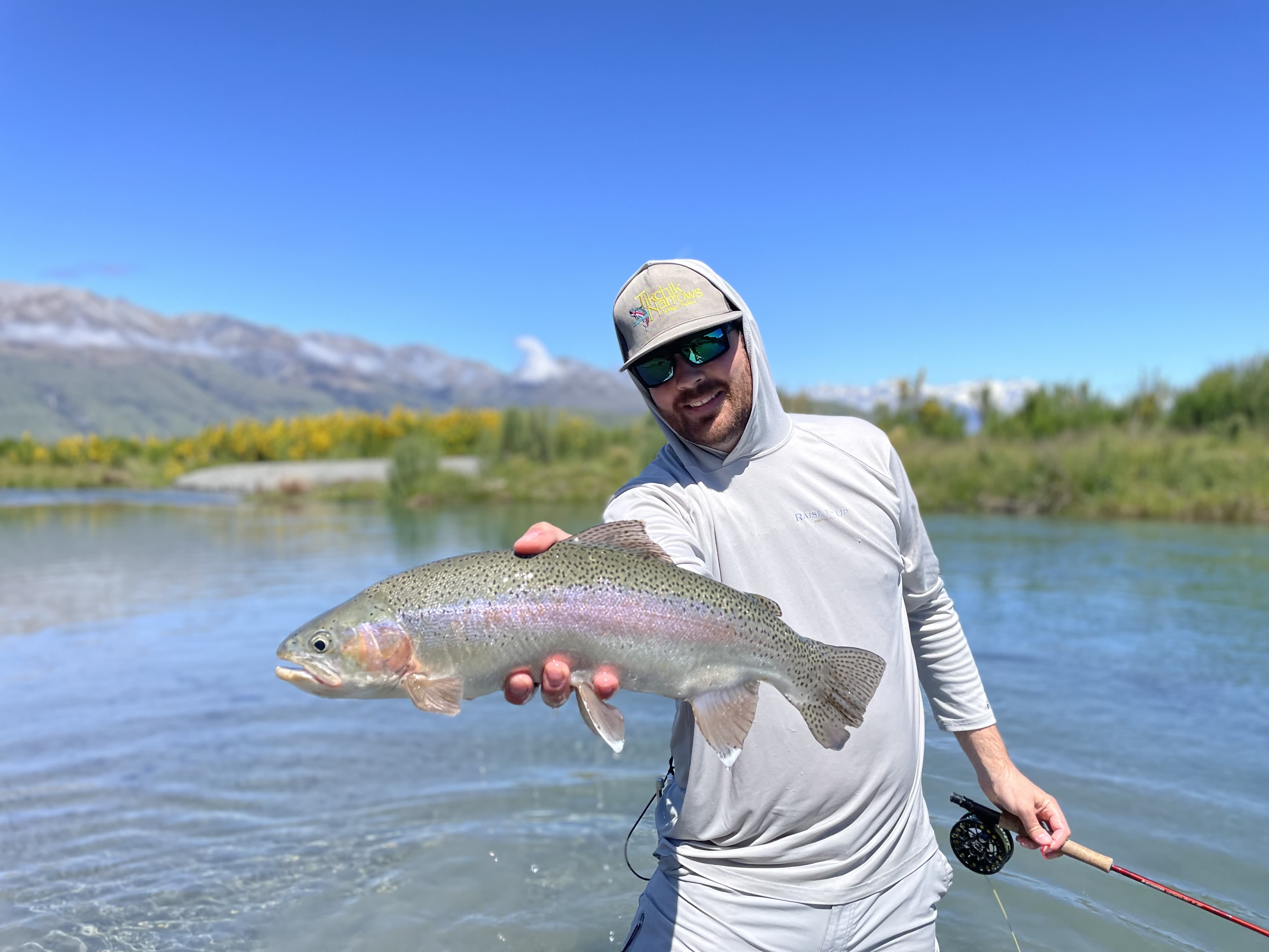 Guided sight-fishing on a clear South Island river