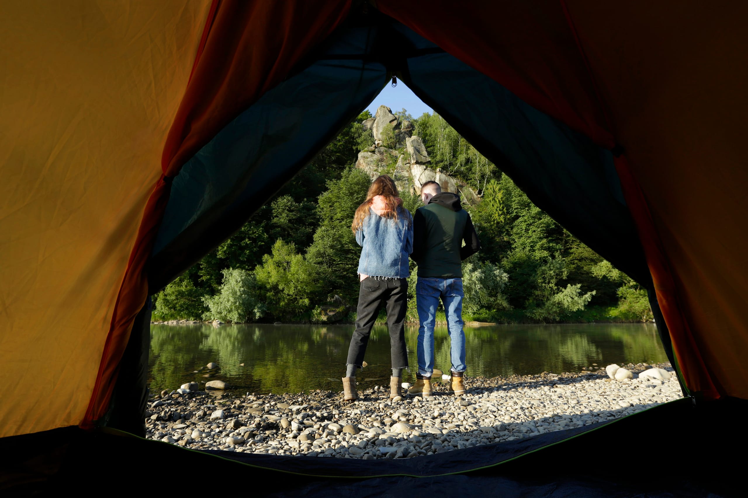 Backcountry campsite beside a remote New Zealand river
